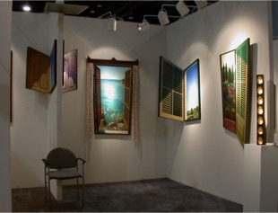 Stand view, paintings by Paul Critchley at art miam 2003 with Portals Ltd gallery