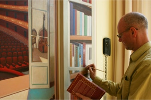 The Music Room Installation, detail of the lettering on the painted books being painted by Paul Critchley 