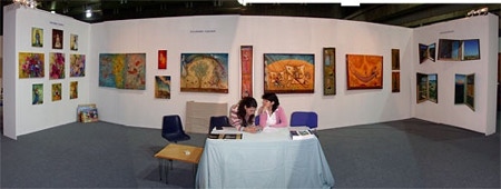 view of stand at Art Manege showing paintings by Paul Critchley